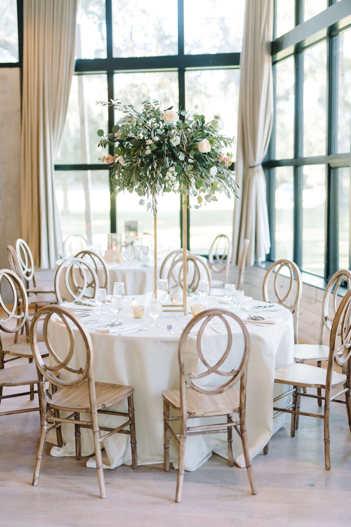 wedding reception with tall floral centrepieces