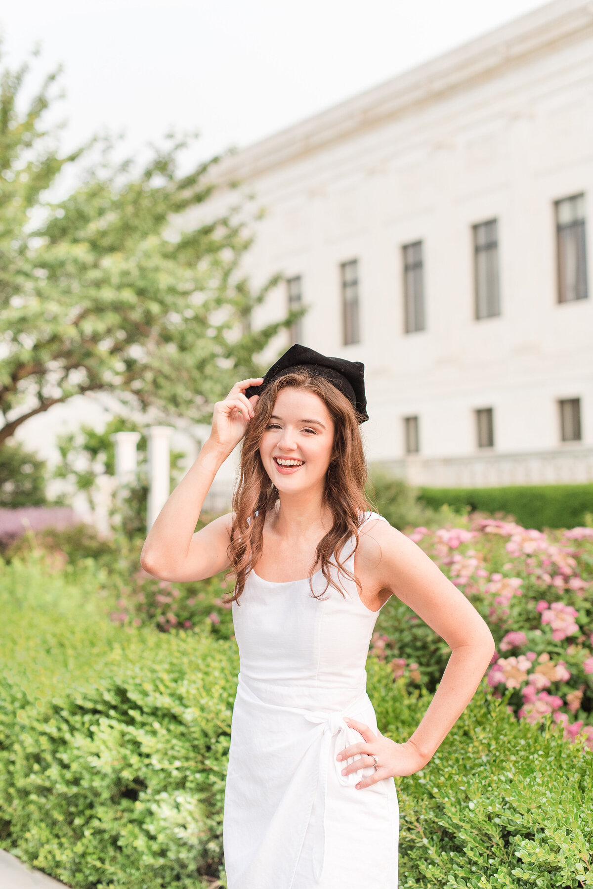 grad white  dress in marble building
