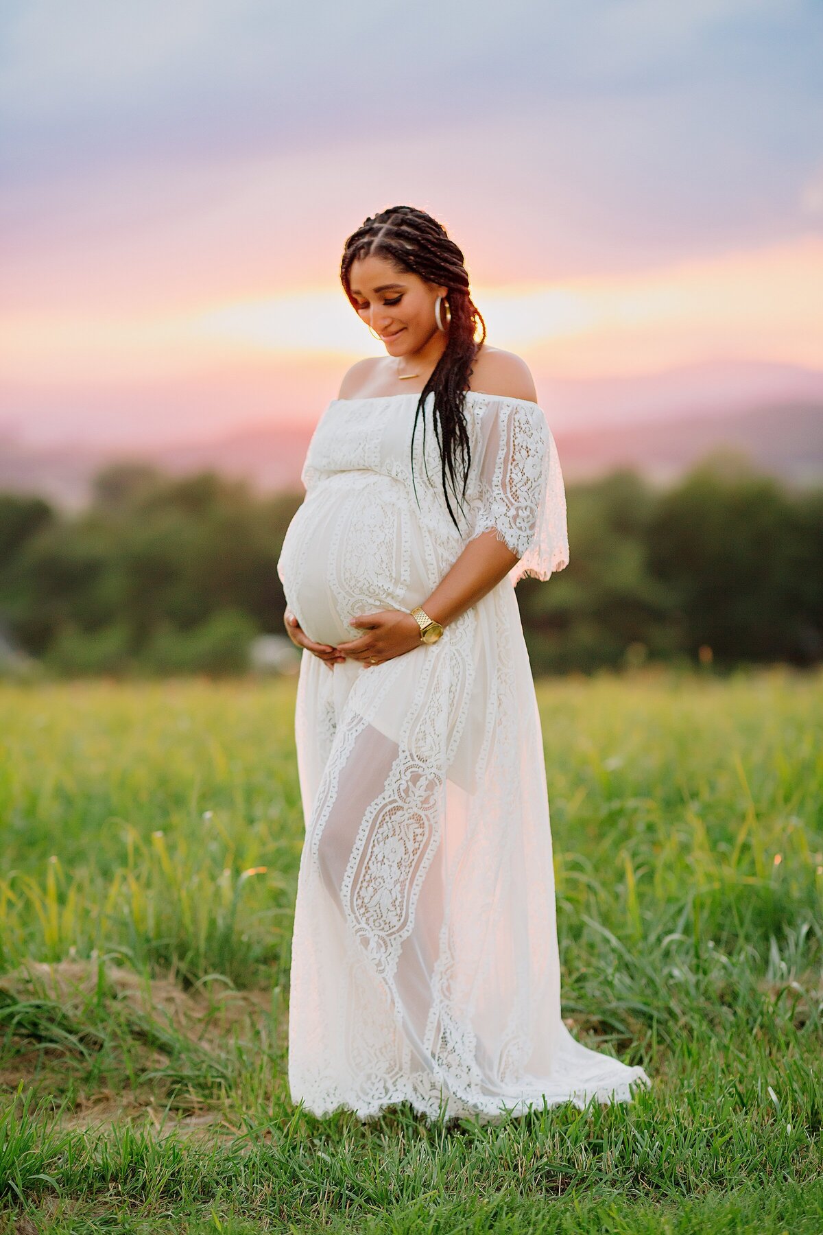 Pregnant mom in white gown at sunset near Harrisonburg, VA