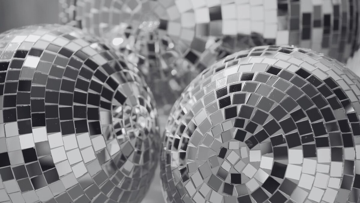 black and white photo of disco balls