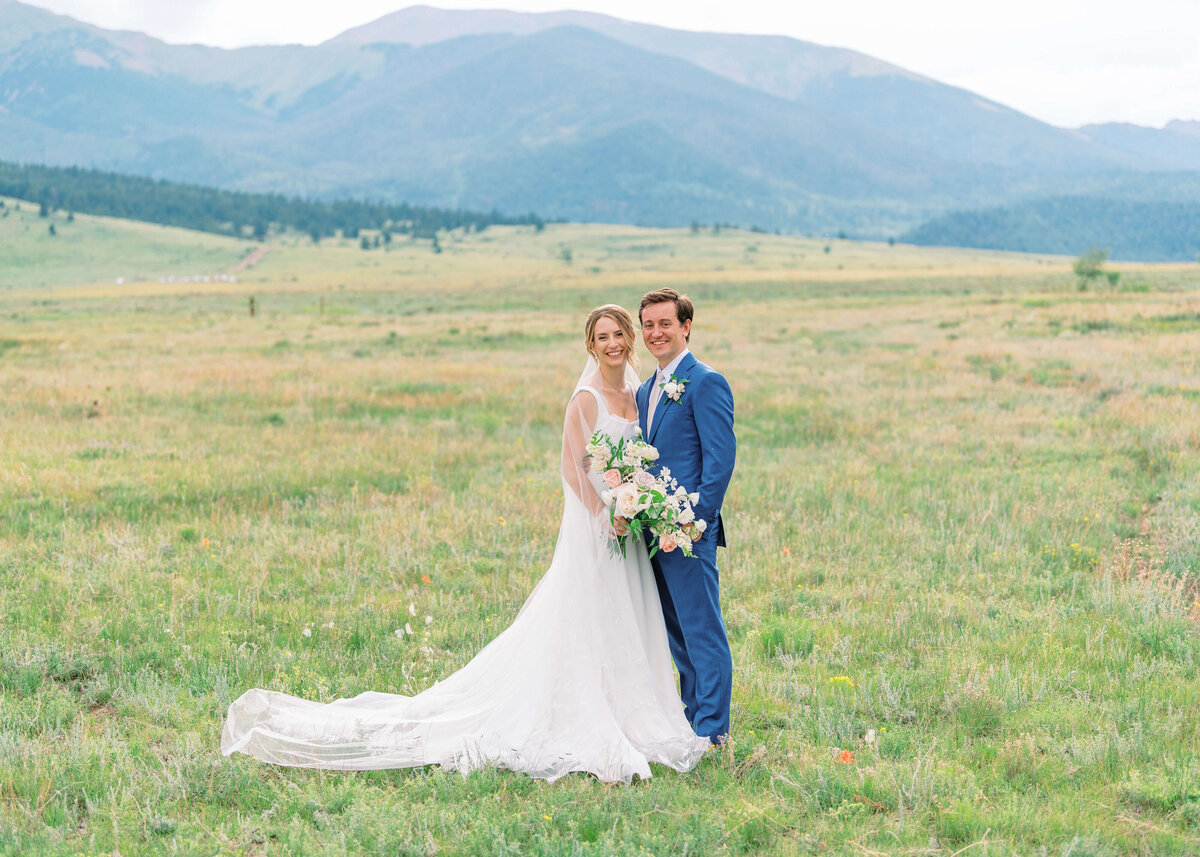 For their formal bridal portrait the couple stood in a field of wildflowers at sunset