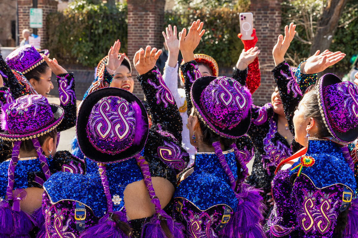 Group of young woman dancers celebrating after dancing down the streets of Northern Virginia during an event. A local parade. capture by Branden Gonzalez, of Brandgo Photogtraphy 
