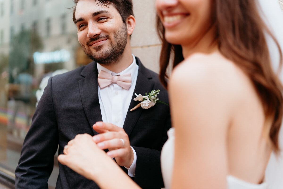 A genuine, unscripted moment of the groom smiling warmly at his bride, reflecting the charm of candid wedding photography. This photograph embodies the essence of documentary wedding photography in Pennsylvania, focusing on authentic emotions and timeless storytelling