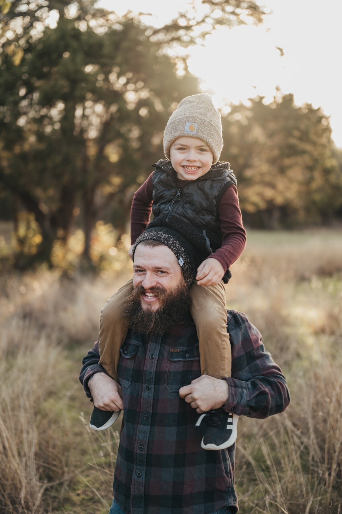 son-on-dad-shoulders-laughing