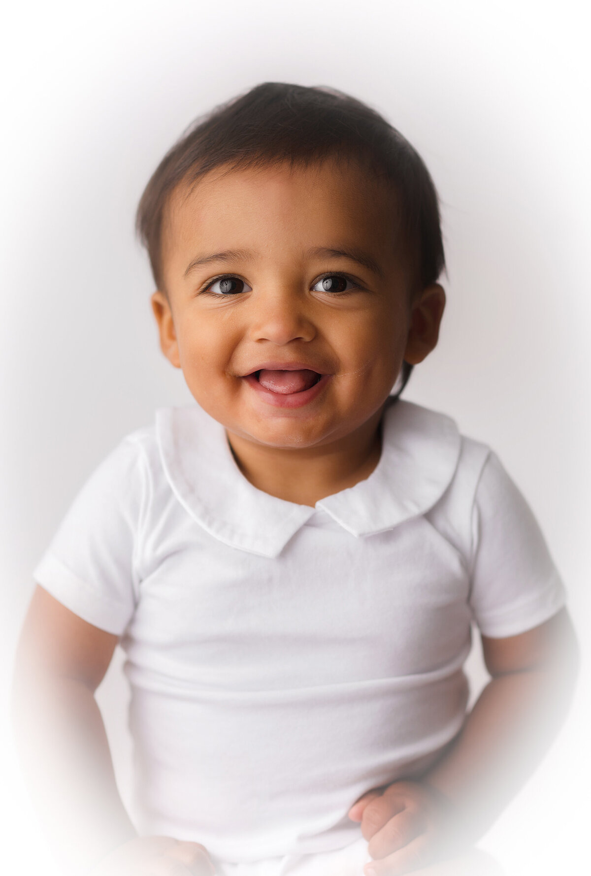 Baby smiles into the camera during Heirloom Portrait Photoshoot in Charleston.