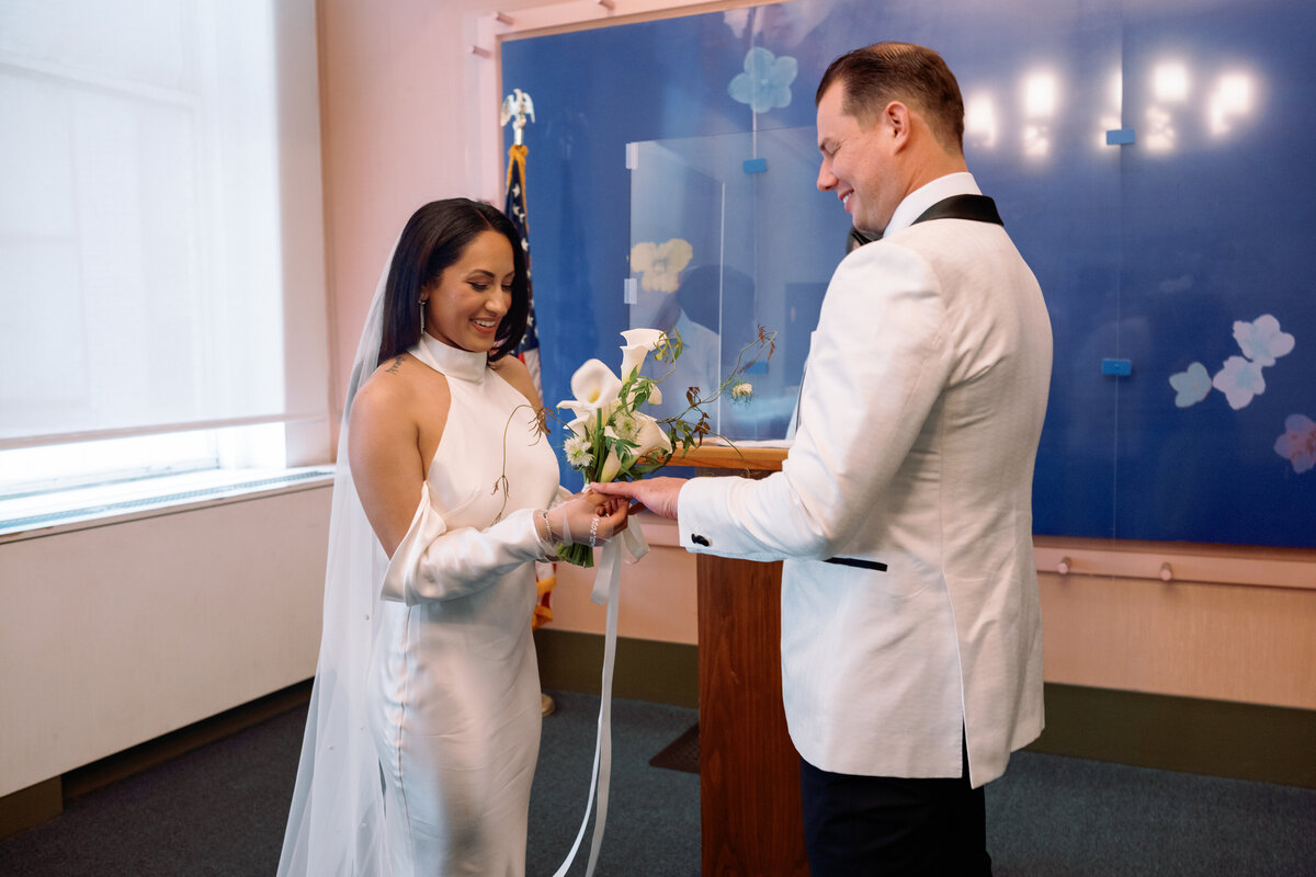 Japna and Chris exchange wedding rings during their NYC City Hall elopement ceremony