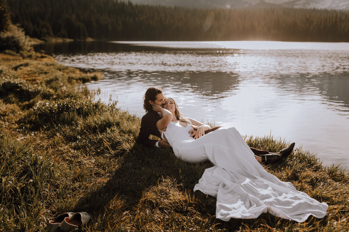bride and groom eloping on lake