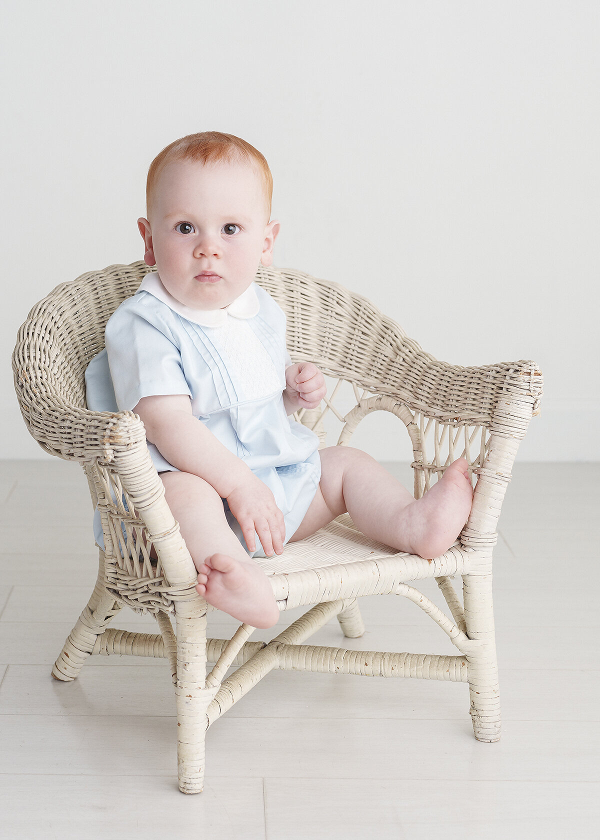 8 month old baby boy photographed in a feltman brothers heirloom millenial style outfit in studio in brunswick ga