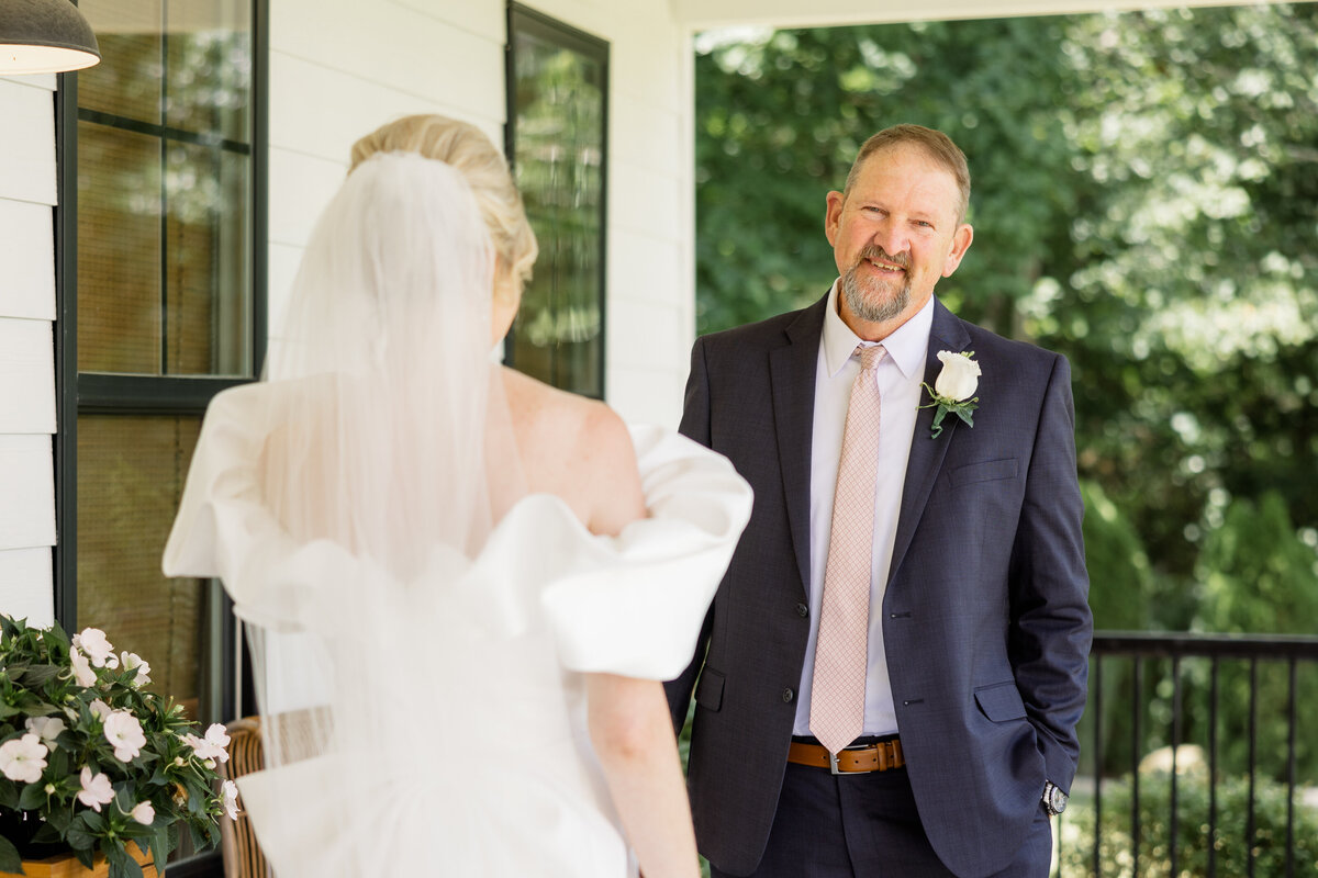 First look with bride & dad on porch of bridal cottage. 