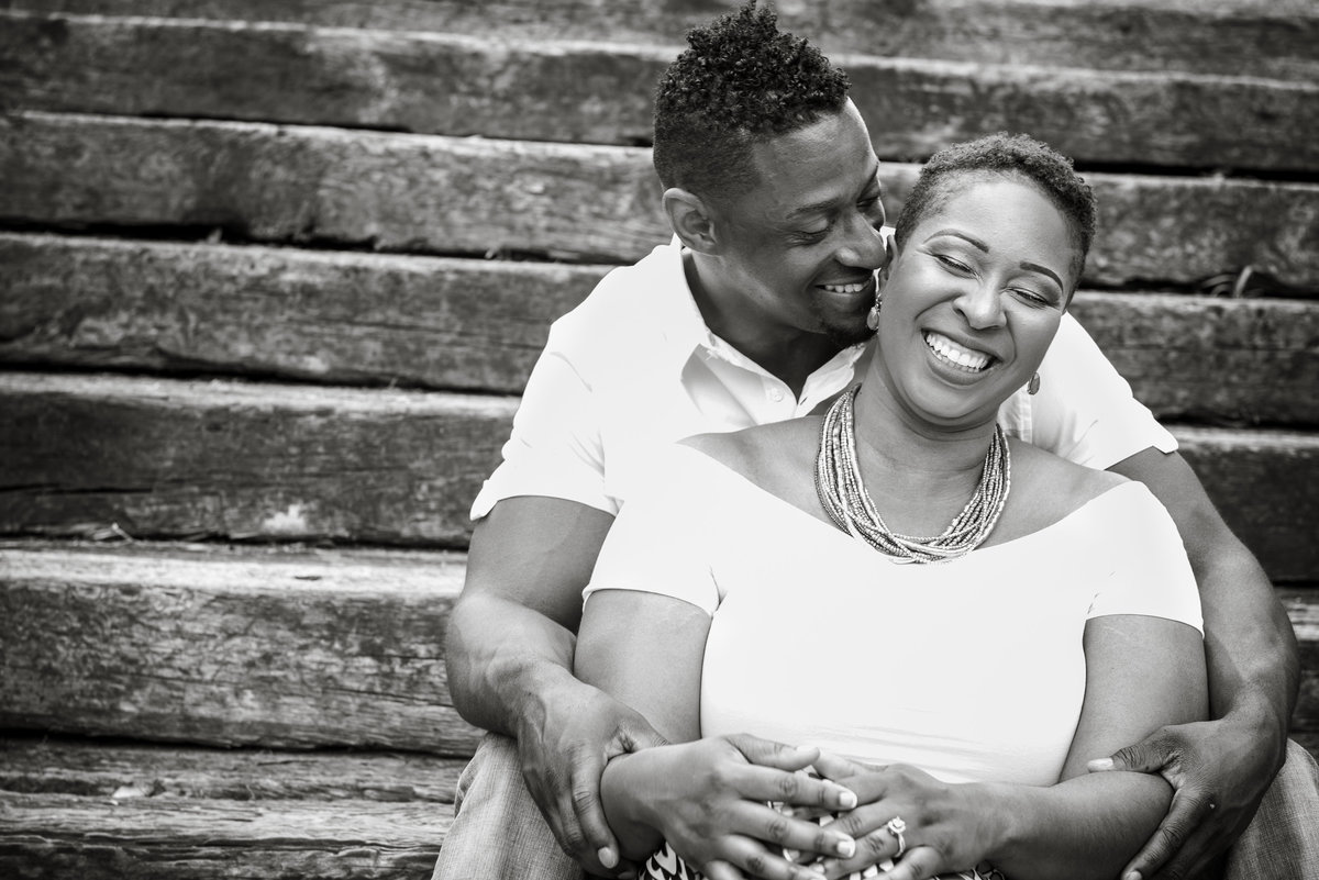 couple sitting on steps smiling