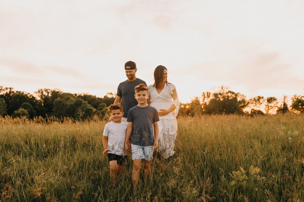 Co-founder and husband and wife team with their 3 sons in wildflower fields