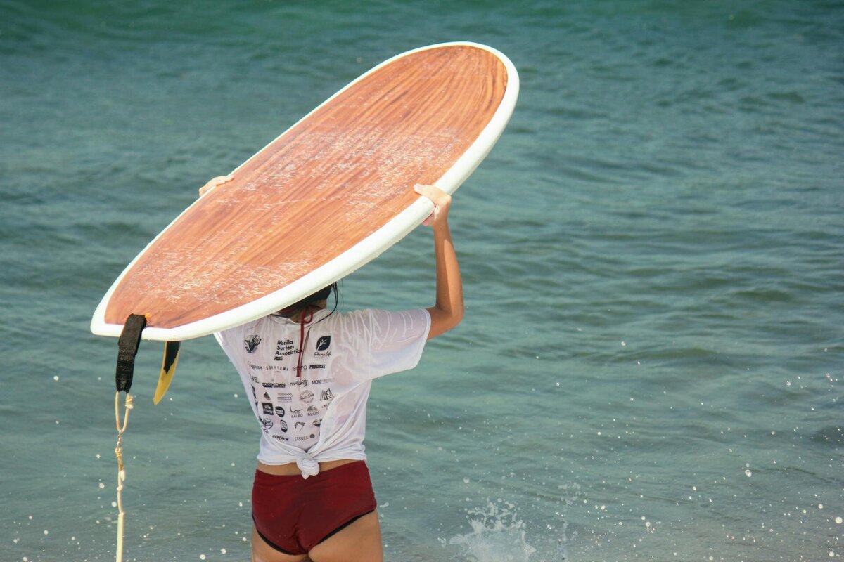 woman holding surfboard 2