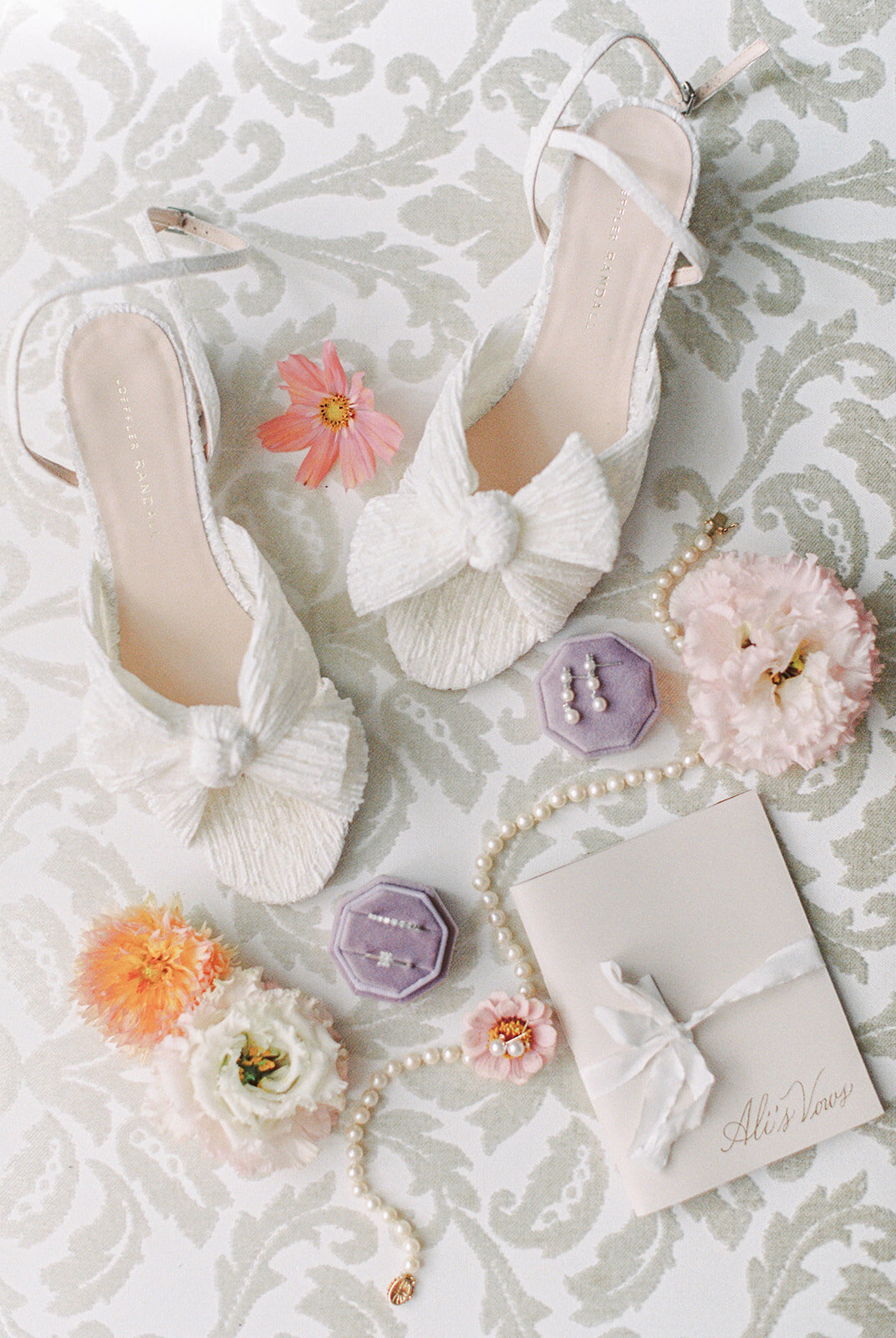 Flowers, shoes, jewelry, and other bridal accessories are displayed at the Forest and Stream Club.