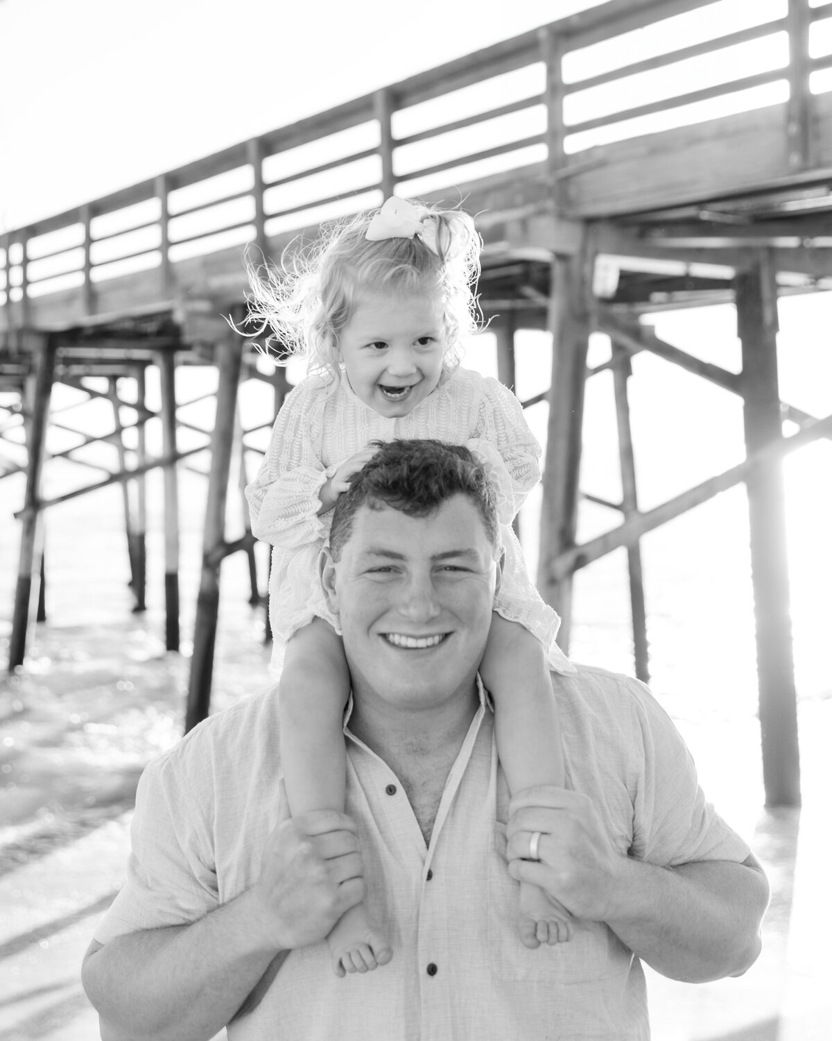 black and white photo of dad and daughter