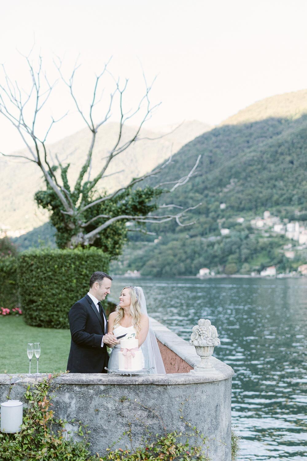 cutting cake at lake como