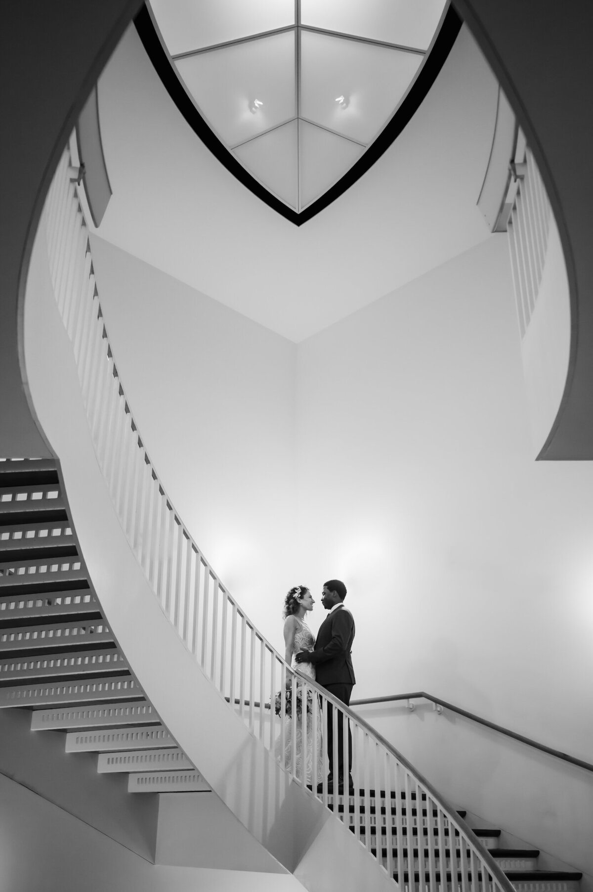 bride and groom on the staircase at MCA in Chicago, Illinois