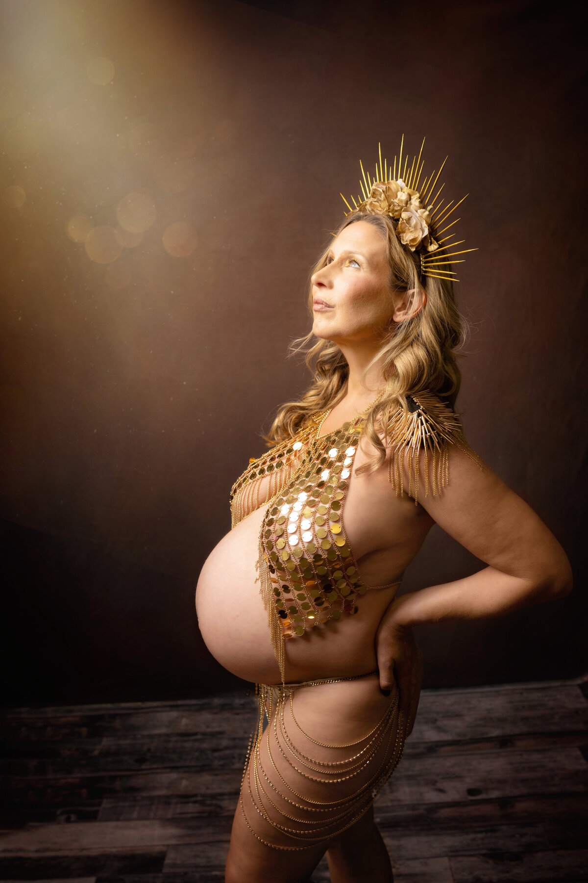 golden halo shimmer light brown pregnant exposed belly