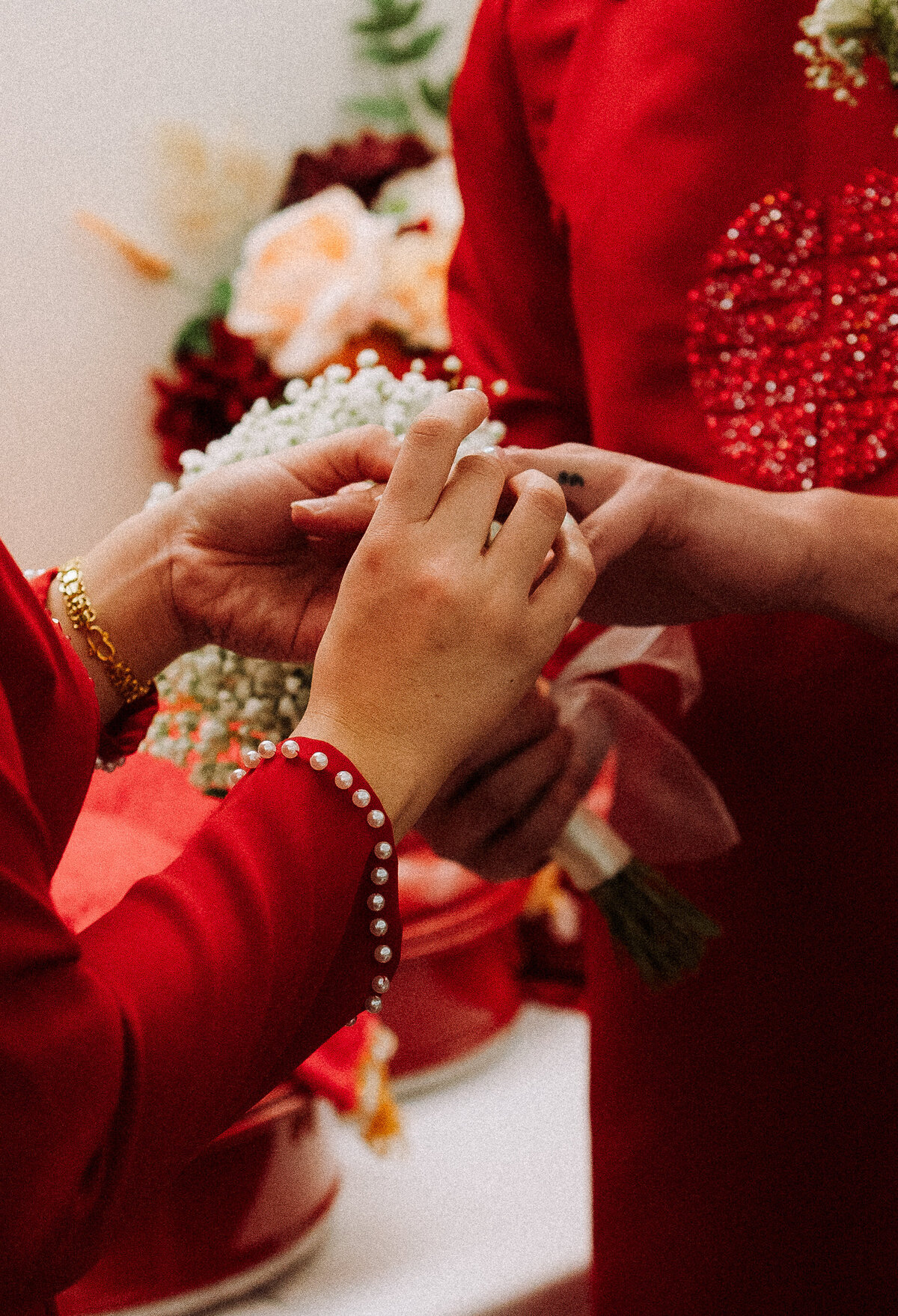 close up of bride and mother's hands