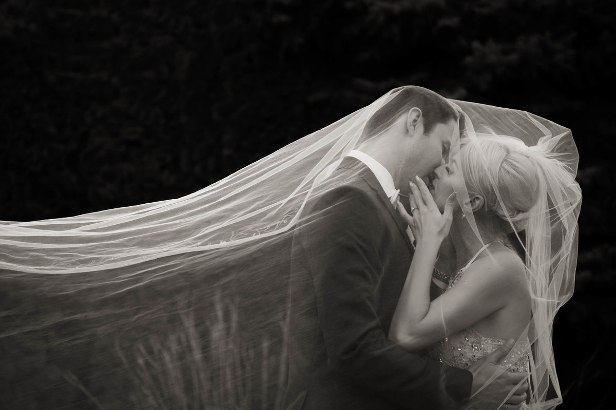Kelowna Wedding Bride and groom kissing under veil
