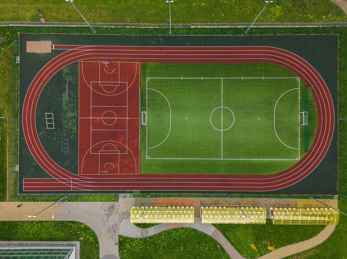 aerial-view-of-a-multisport-field-featuring-a-trac-2025-04-03-20-38-36-utc
