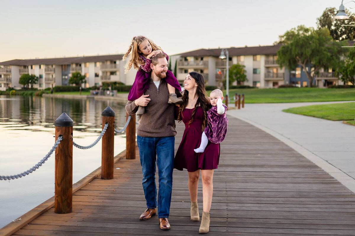 Family walking together on a lakeside boardwalk in San Mateo during sunset – Bay Area Family Portfolio – Ellobelle Photography