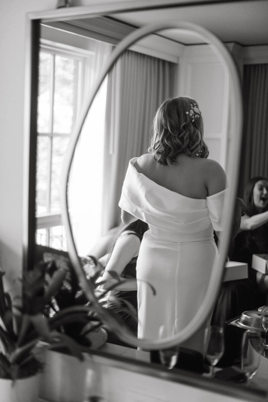 Bride getting ready at St. Regis Aspen, captured in a light-filled suite with elegant decor and a serene, romantic atmosphere.