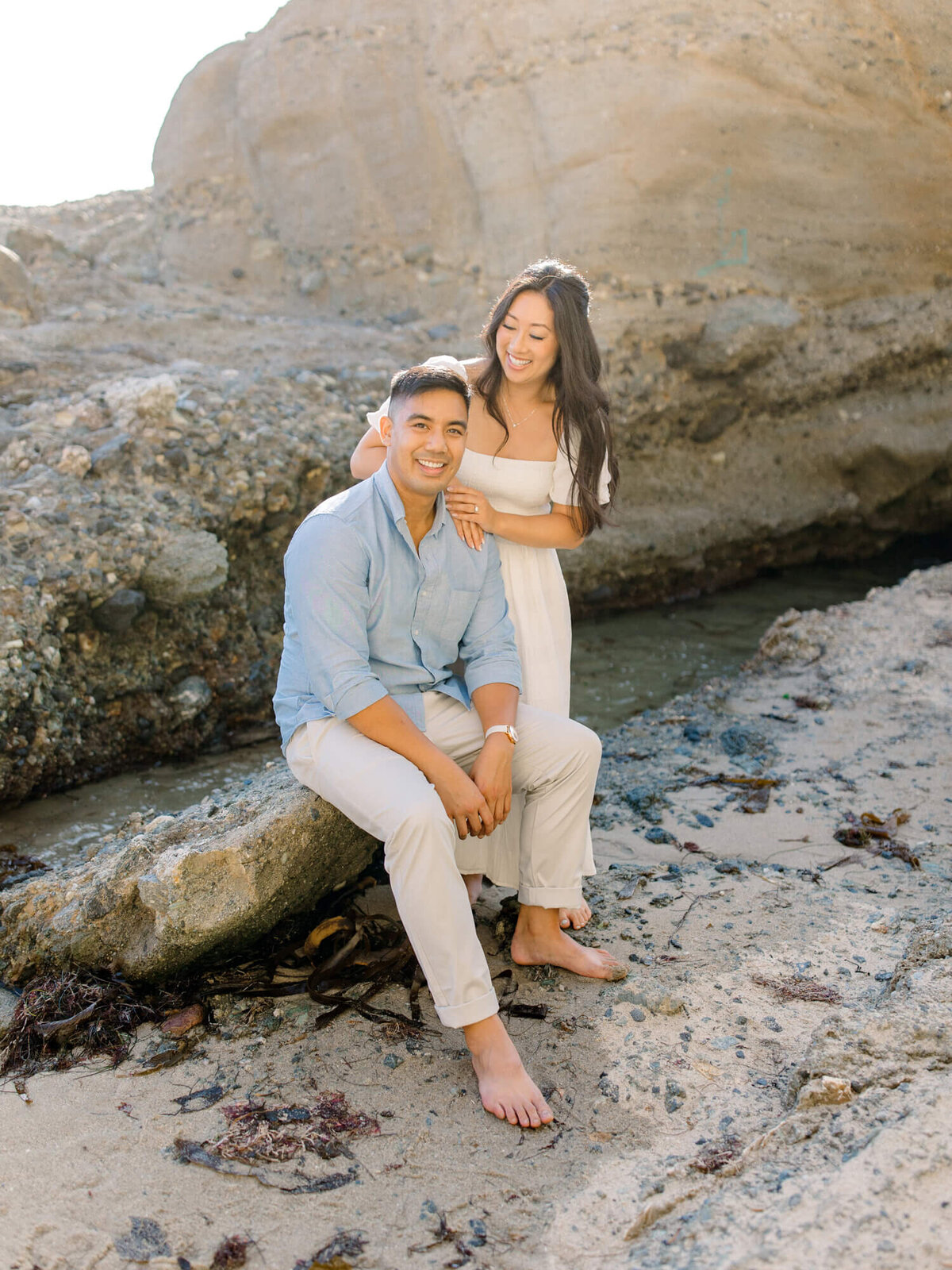couple engagement photo man wearing blue collared shirt and girl wearing white dress