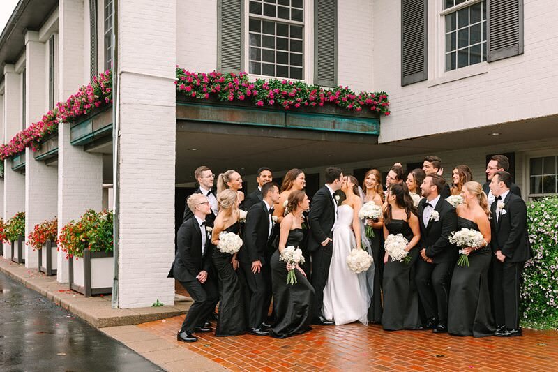 bride-and-groom-rainy-umbrella-evansville-country-club06