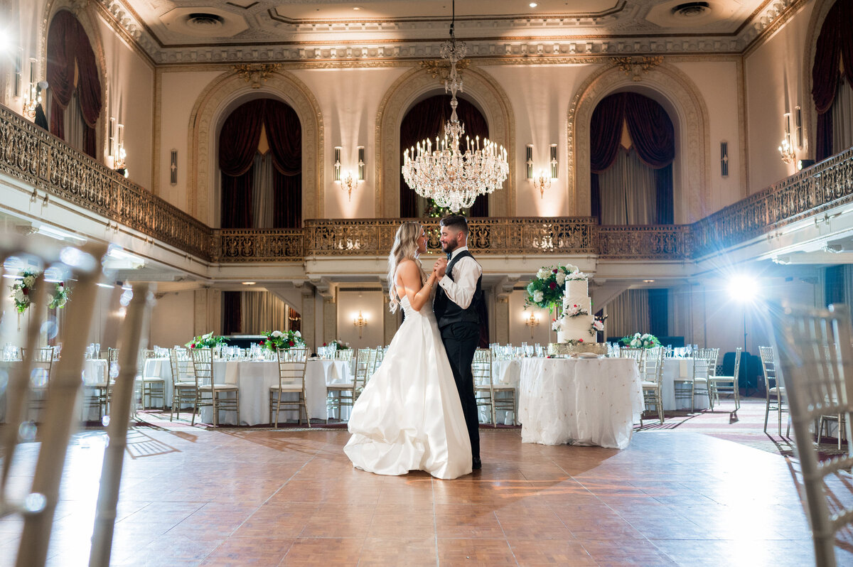 couple dancing together in omni grand ballroom