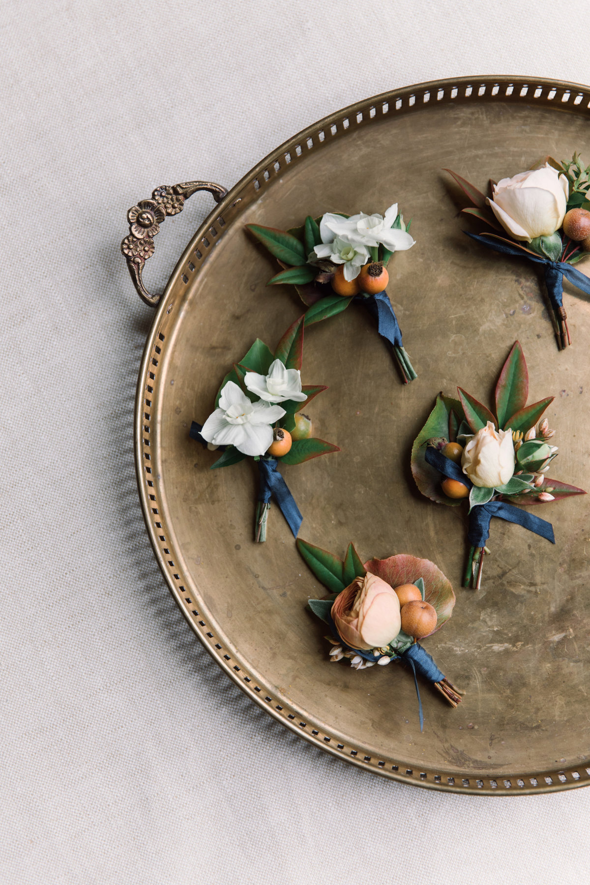 Boutonnieres for wedding by Jenny Schneider Events at a private residence in Marin County, California.