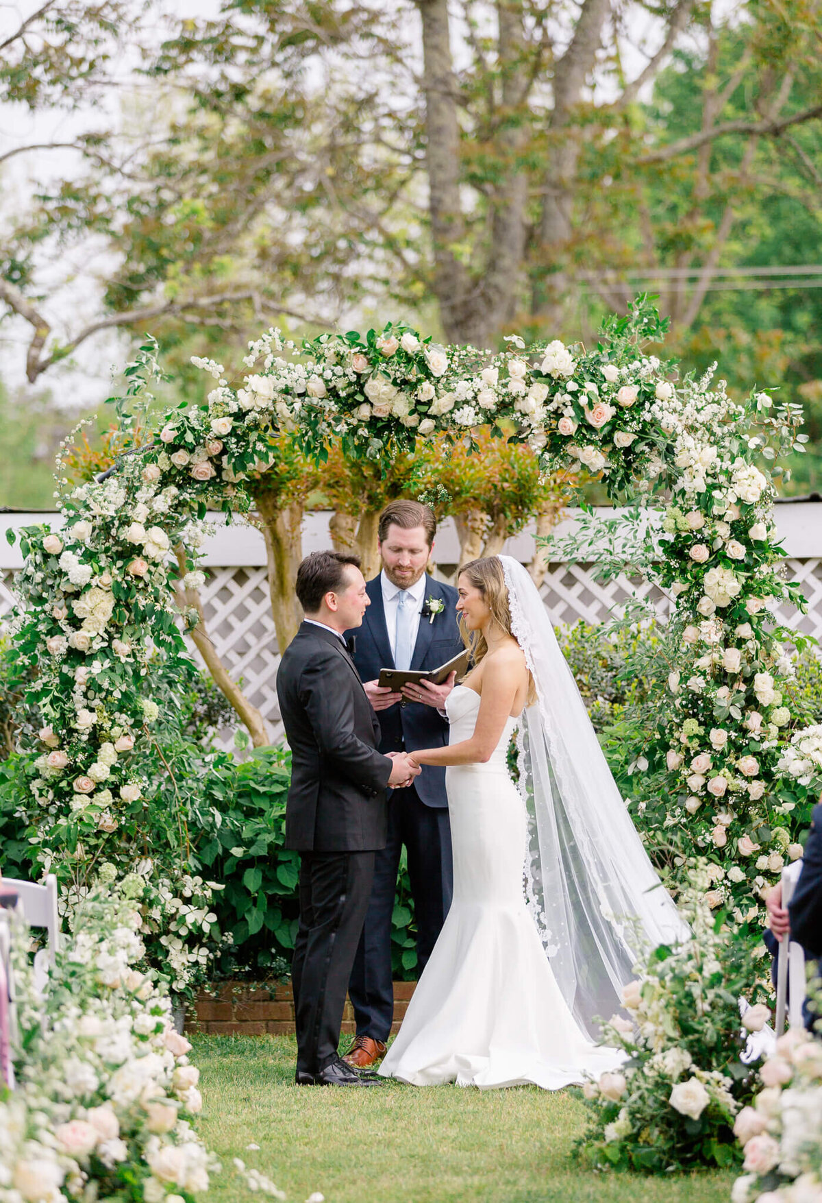 Bride and Groom holding hands during their wedding at The Clifton.