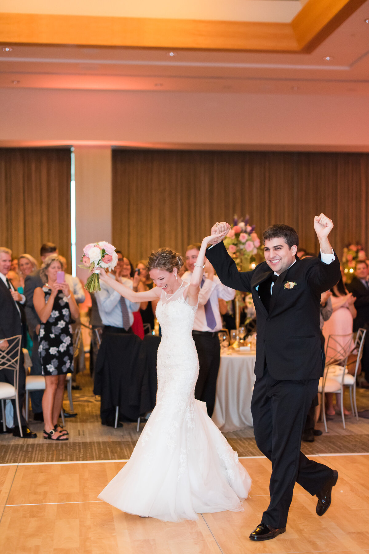 bride and groom being introduced into their wedding reception at the fairmont hotel