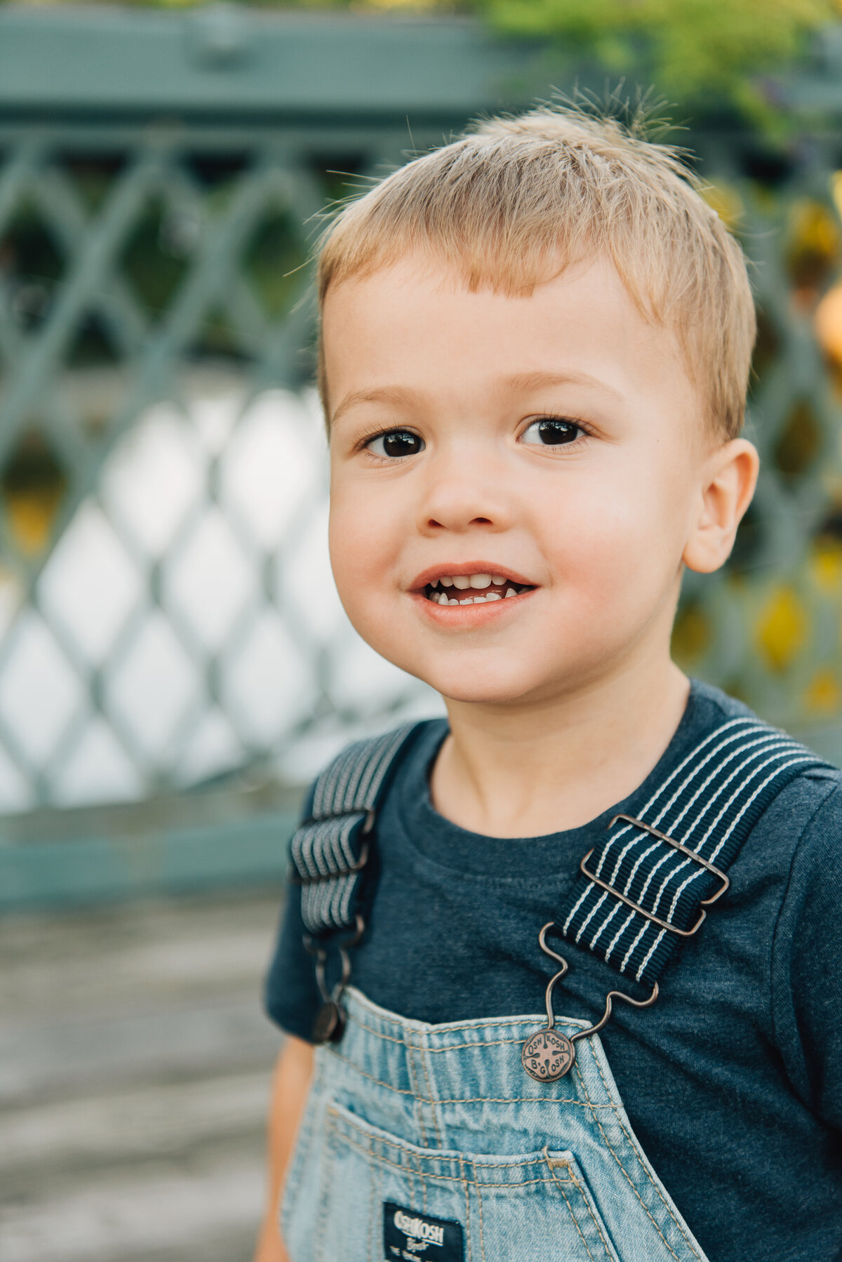 Close up of young boy playing on bridge