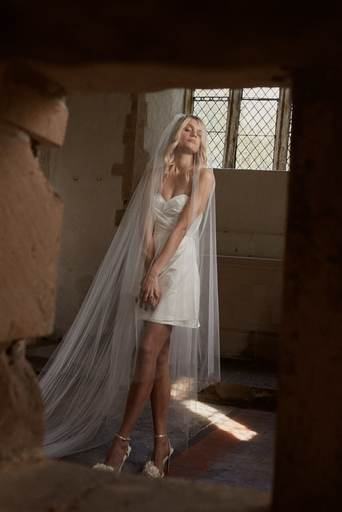 Bride in mini silk wedding dress, wrap bridal gown, photographed by Benjamin Wheeler