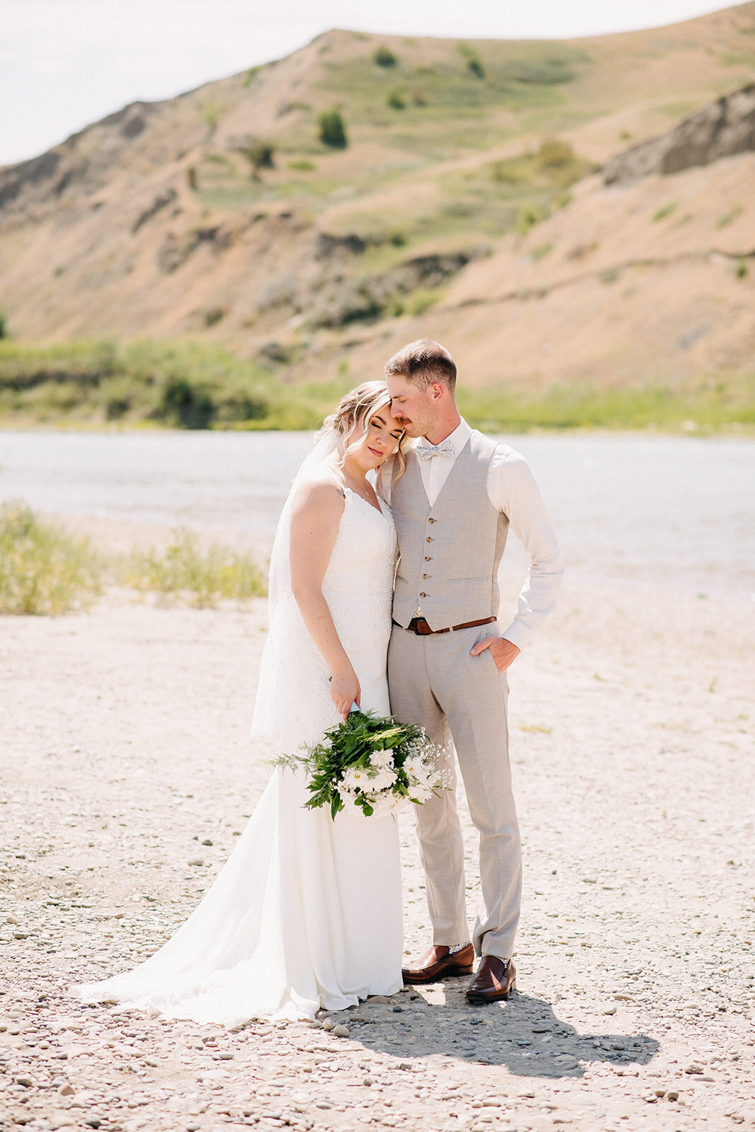 Bride and groom embracing, captured by Kristin Sarah Photography. Featured on the Bronte Bride Vendor Guide.