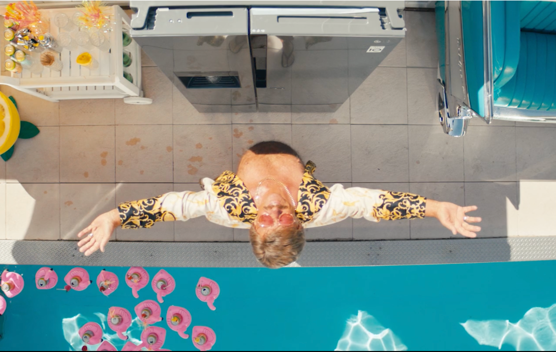 Playful summer scenes from OTTO's Swimming Pool campaign, shot with vivid colors and warmth by Stephan Burchardt.