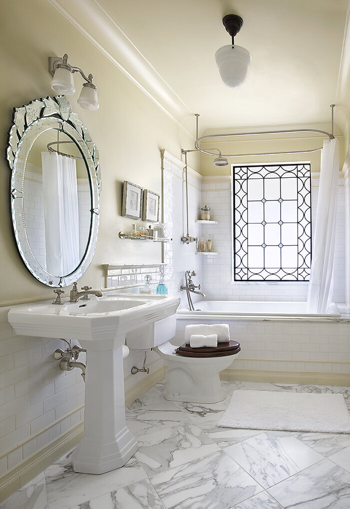 Panageries Residential Interior Design | Tudor Revival Estate Master Bath with Stain Glass Window and Embellished Mirror