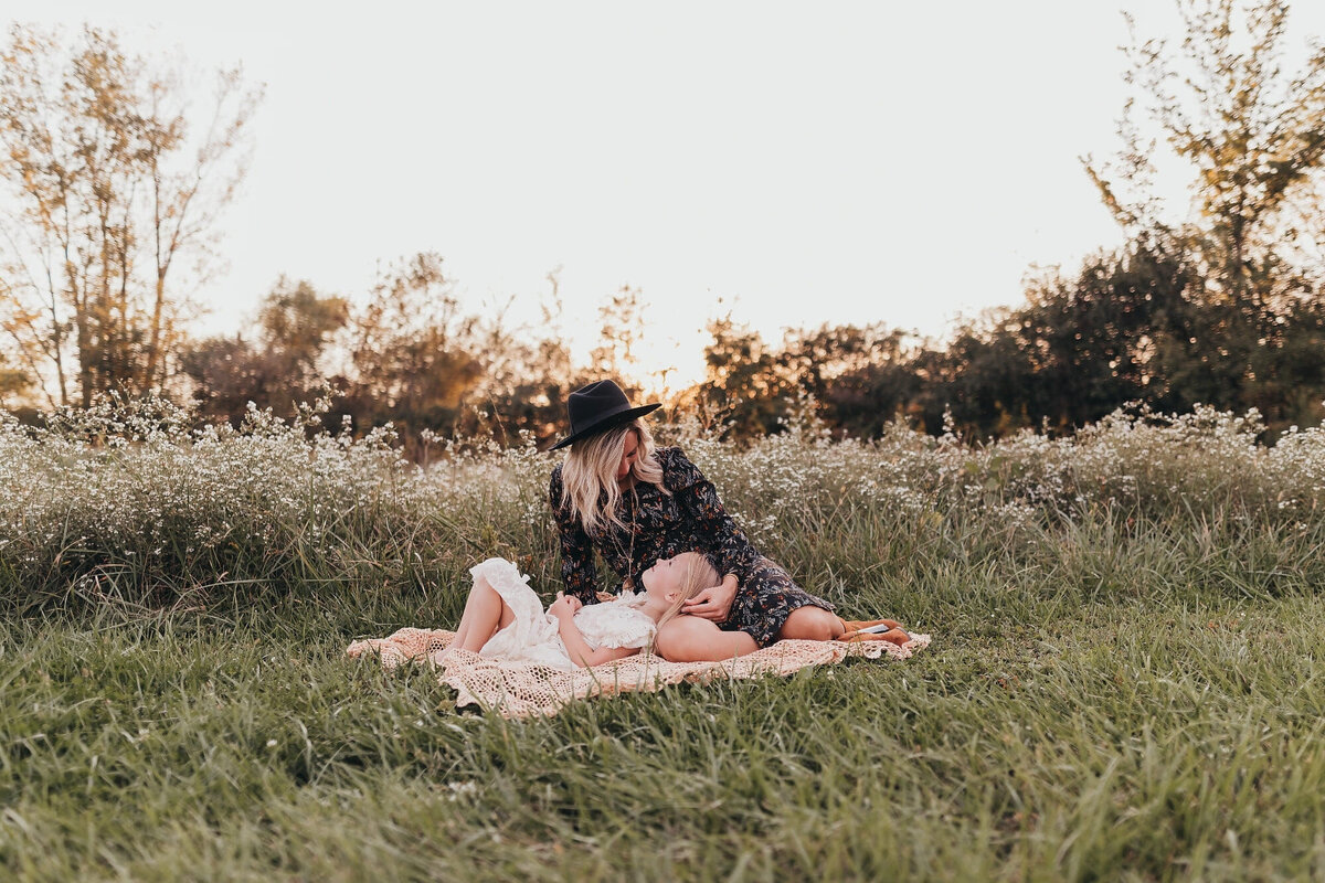 mother and daughter in a field together