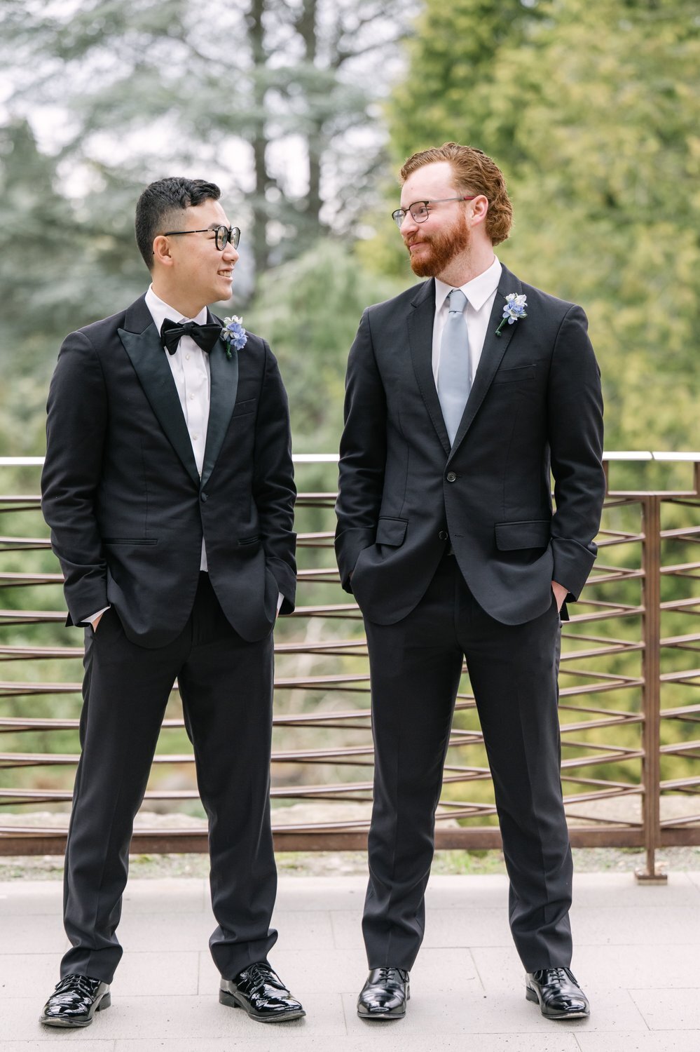 groomsmen and groom on deck at park
