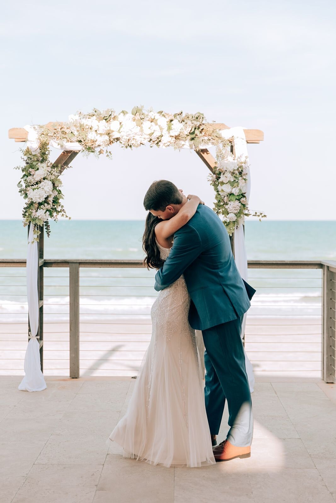 bride and grooms first kiss