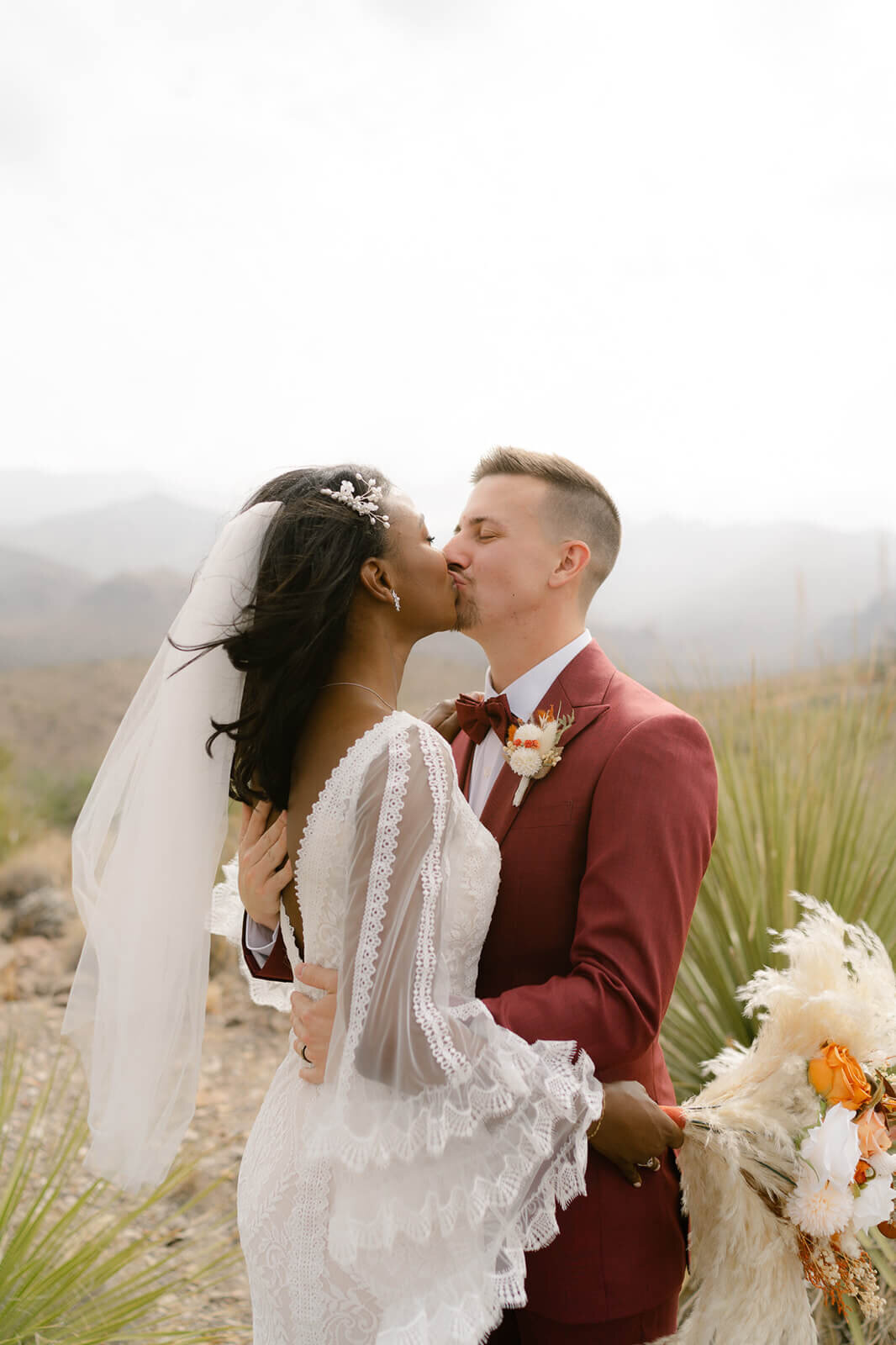 couple kissing with the Chisos Mountains behind them