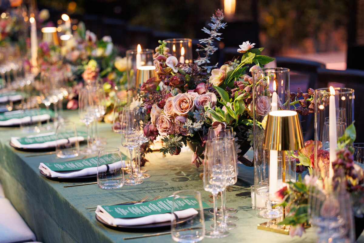 five green menus and florals that Marketa Events created