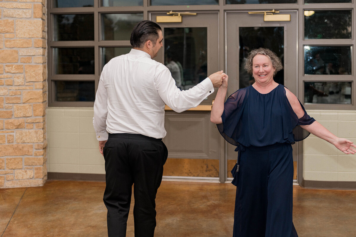Candid hugs between wedding guests