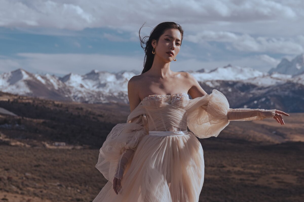 A woman photographed in one of 3N7LOVE's stunning couture dresses.