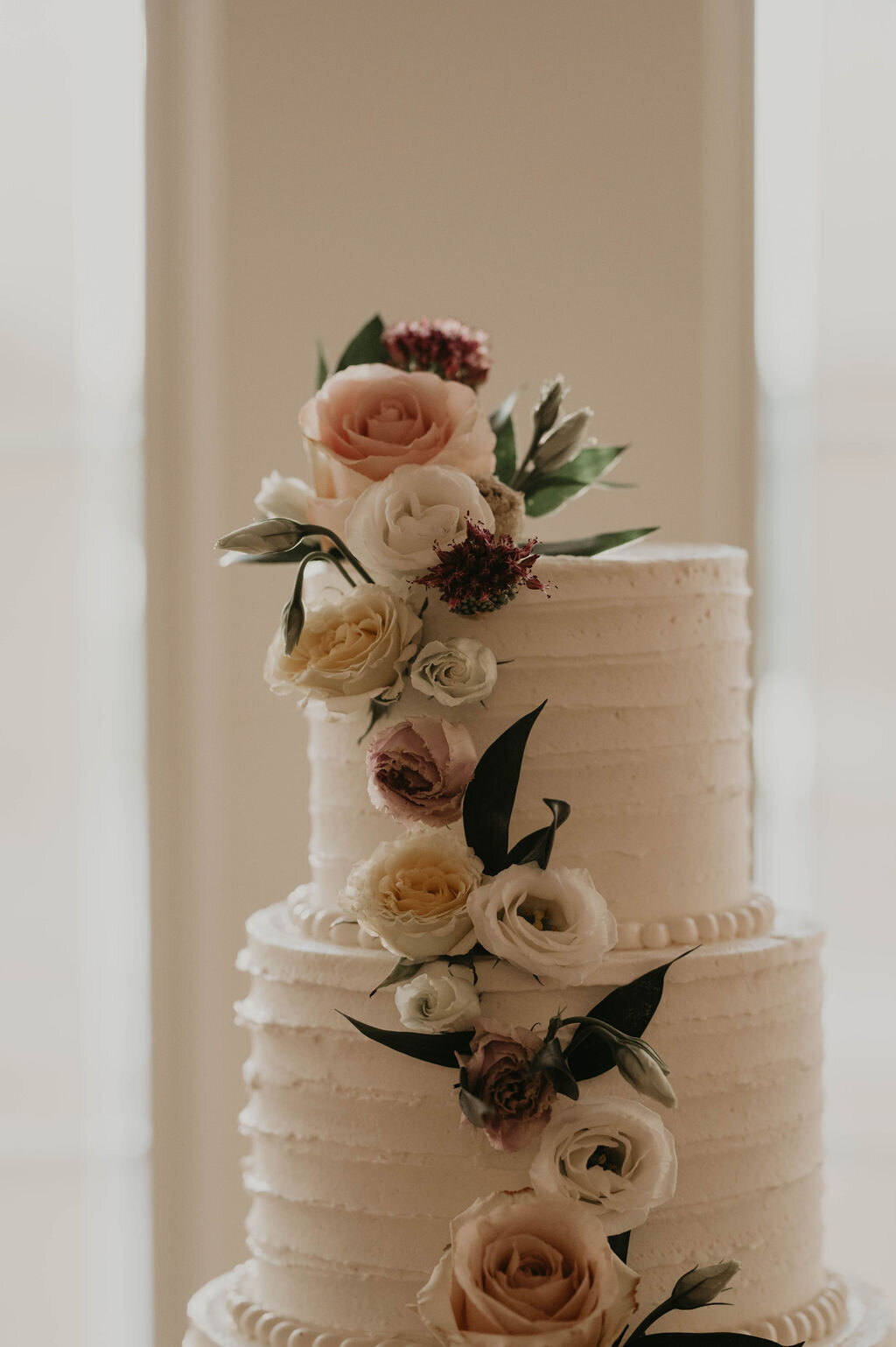 white-buttercream-floral-wedding-cake
