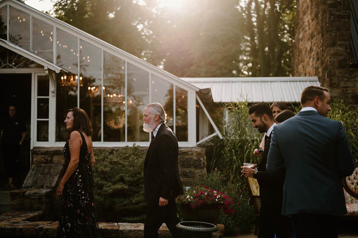 Wedding guests walking outside during a wedding. 