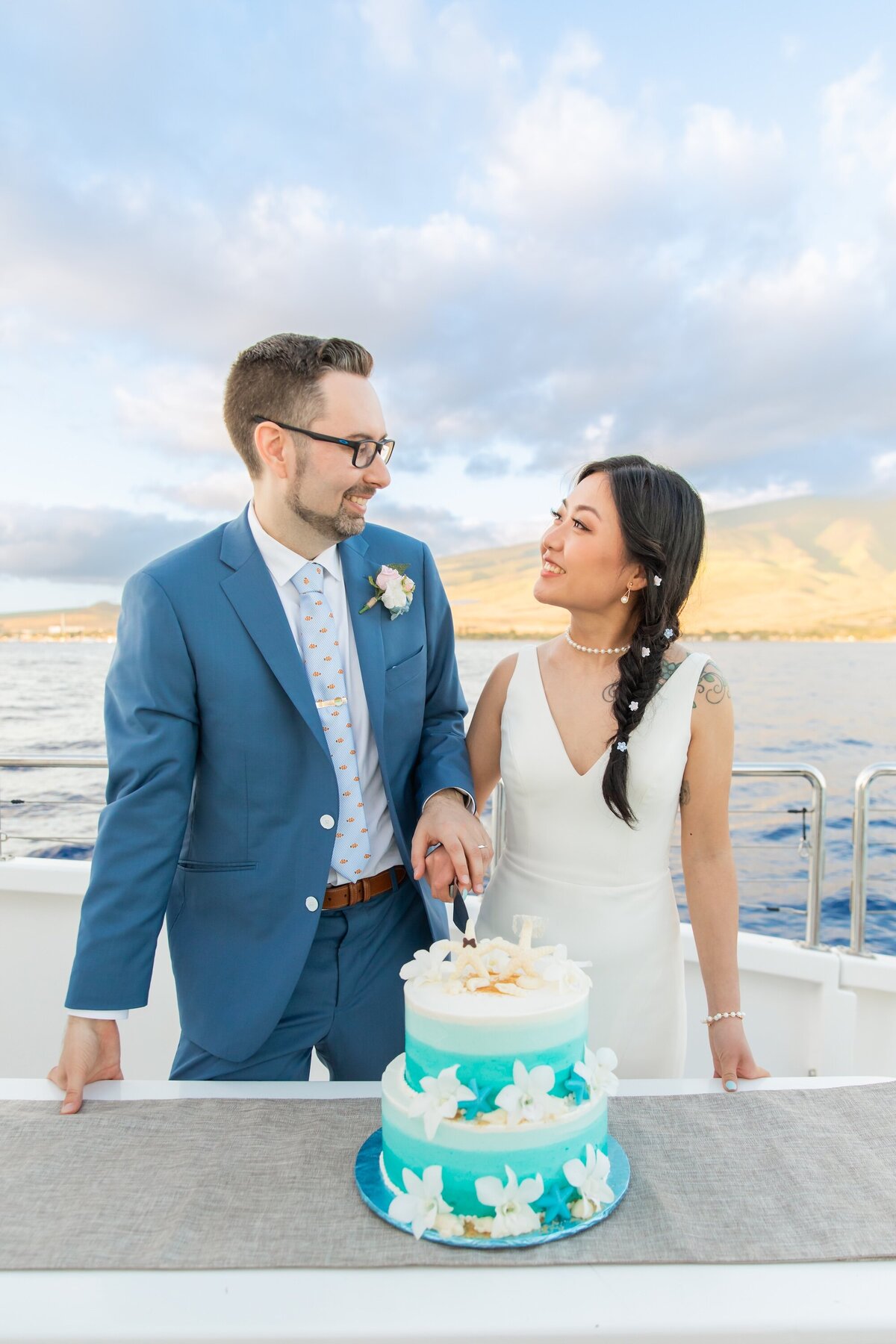 Maui wedding cake cutting photo aboard Trilogy