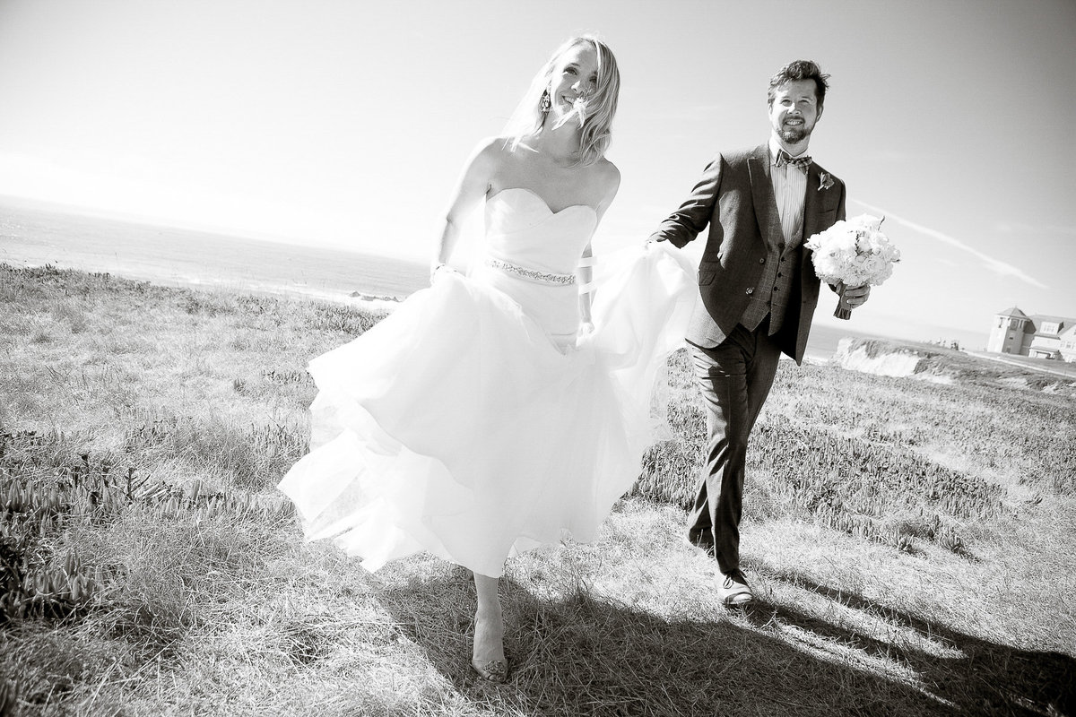 Newlyweds at their cliffside wedding at the Ritz-Carlton in Half Moon Bay.