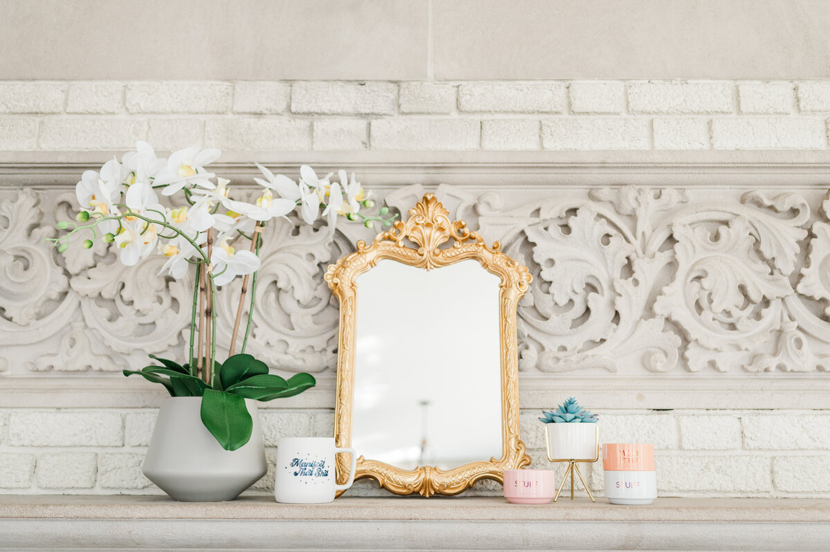 Ornate white carved fireplace mantel