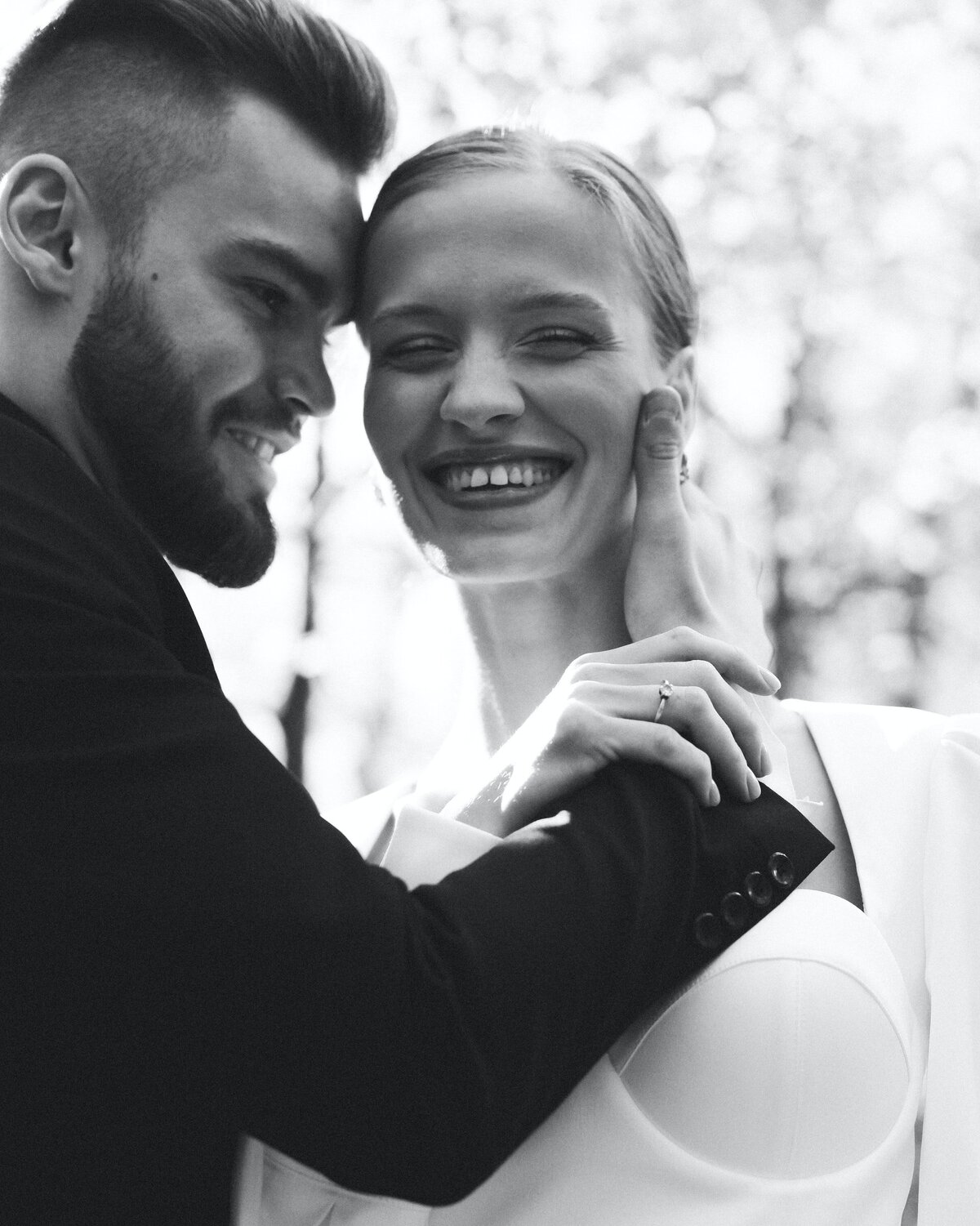 newlyweds-smiling-at-camera